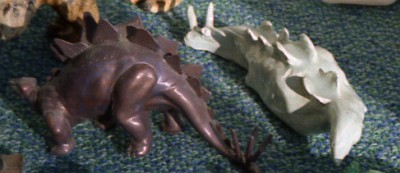 clay and plastic dinosaur